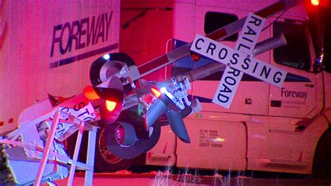 Semi-truck stopped on railroad tracks after crash | WOODTV.com