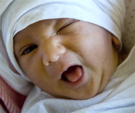 New Born Baby winking stock image. Image of child, closeup - 12496445