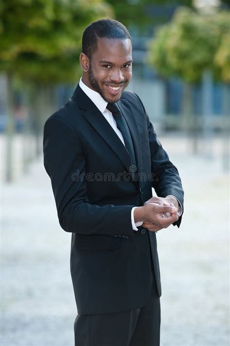 Young Black Man Smiling In A Suit Outside Stock Photo - Image of ...