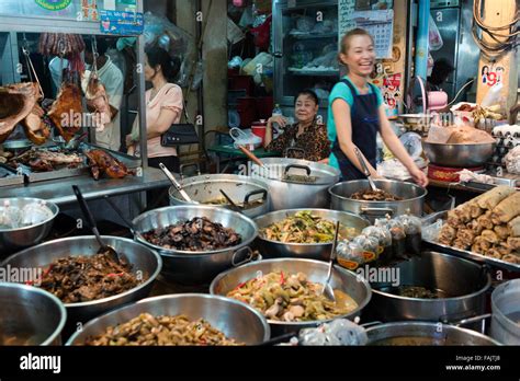 Market stall and street food being prepared in Chinatown Bangkok, Thailand. Yaowarat market ...