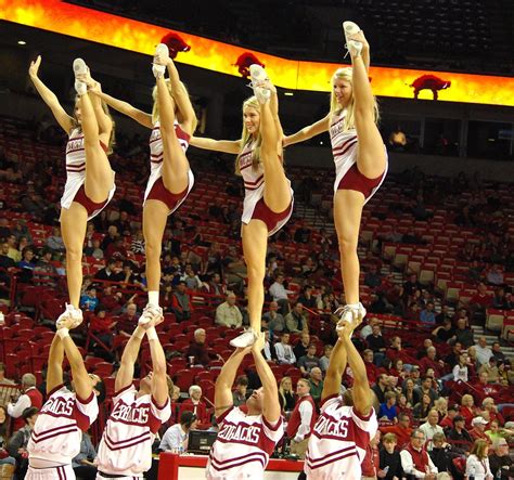 Handsful of Hog Cheerleaders | Four high kicking Razorback c… | Flickr