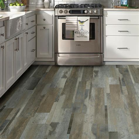 TrafficMASTER Grey Distressed Wood Multi-Width Look 6 in. x 36 in. Peel ...