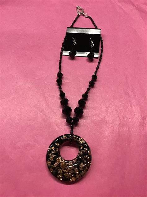 Black beaded necklace set with bronze color circle | Black bead necklace, White leather bracelet ...