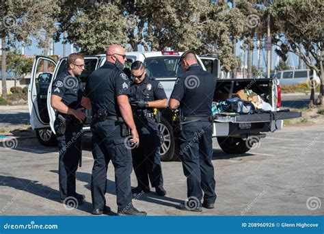 Officers from the City of Ventura Police Department Confer at a Search ...