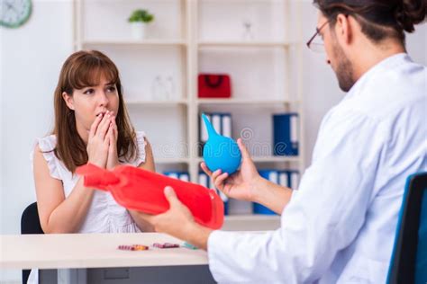 Young Woman Visiting Male Doctor Gastroenterologist Stock Photo - Image ...