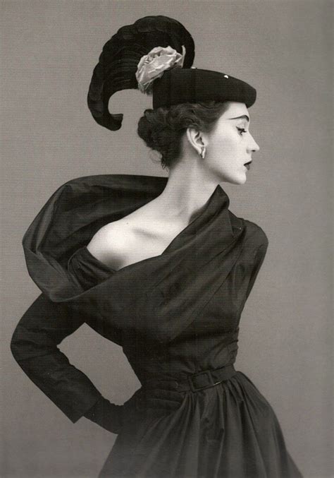 Dovima, wearing a hat and dress by Cristobal Balenciaga, in a 1950 photo by Richard Avedon for ...