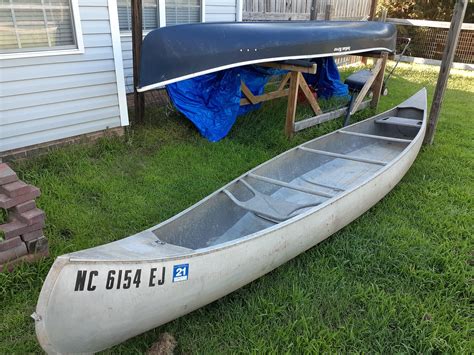 Just picked up a 17' grumman canoe. For only $300. In the background is my other canoe (14 ...