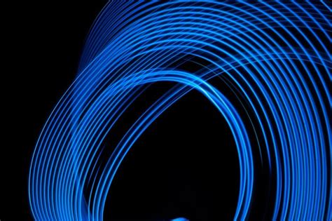 Premium Photo | Abstract background neon electric blue glowing lines