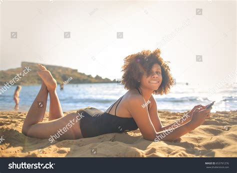 Beautiful Girl Lying Down Beach Using Stock Photo 653791276 | Shutterstock