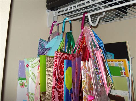 Hang gift bags from carabiners in the closet | Gift bag organization, Craft room closet, Craft room