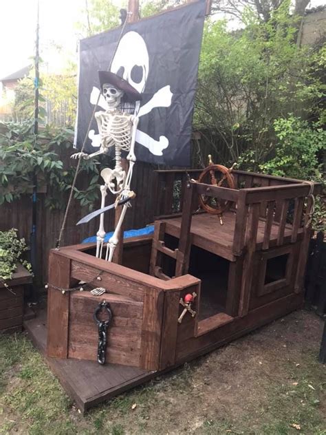 a wooden pirate ship with a skeleton on it