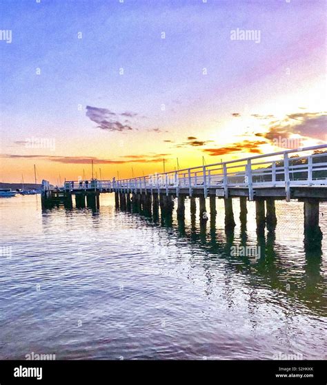 Morning at Balmoral Beach Sydney. Looking out at the jetty pier, enjoying sunrise at 6am Stock ...