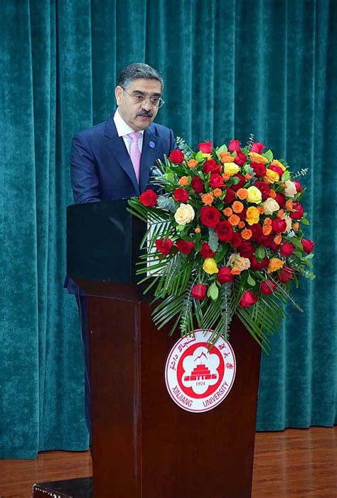 Caretaker Prime Minister Anwaar-ul-Haq Kakar addresses the faculty and ...