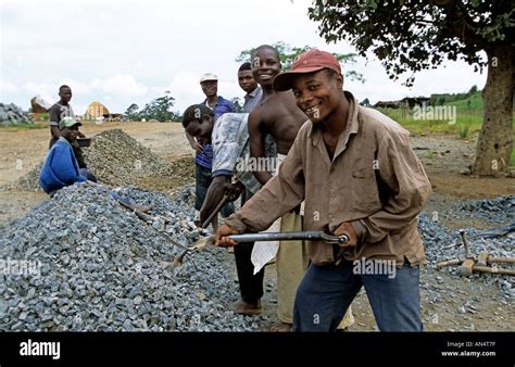 An African workers at the construction site Stock Photo - Alamy