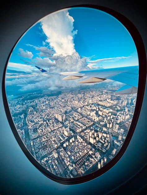 Aerial View of City Buildings Under Blue Sky · Free Stock Photo