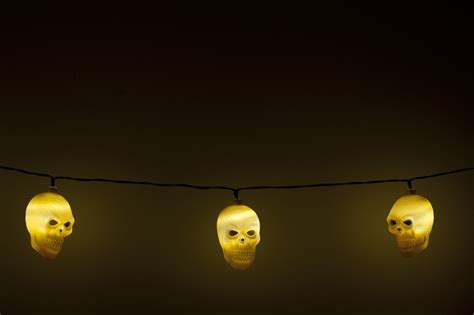 Image of Three glowing yellow Halloween skull lights ...