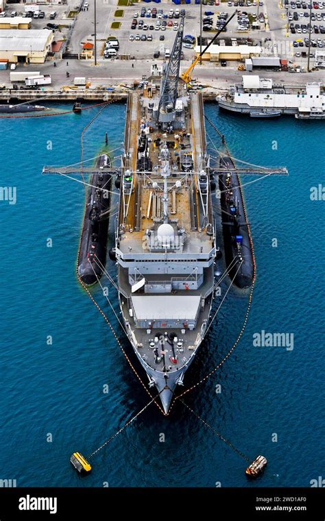 The submarine tender USS Emory S. Land tends to attack submarines USS ...