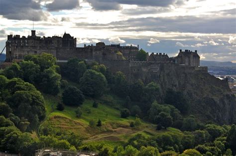 Edinburgh Castle - fortress atop the volcanic Castle Rock - from Princes Street Garden, valley ...