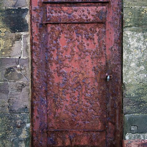 Rusty door. This is located in the defensive wall of Whitehaven Harbour. It looks hundreds of ...