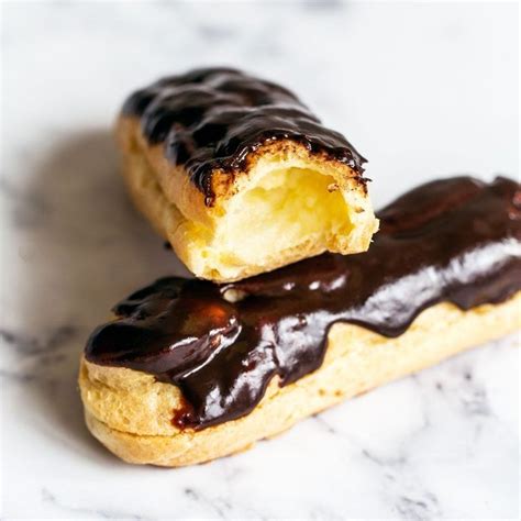 Make bakery-quality Chocolate Eclairs at home with this recipe. The airy pastry shells, rich ...