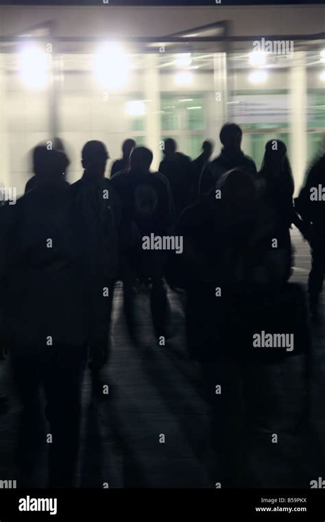 crowd of people walking in street at night Stock Photo - Alamy