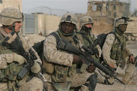 041126-M-5191K-005 U.S. Marines prepare to step off on a patrol through the city of Fallujah ...