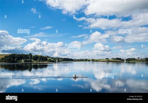 A rower enjoys the sunny weather on Hollingworth Lake in Greater ...