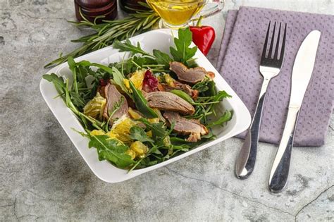Premium Photo | Salad with roasted duck and orange