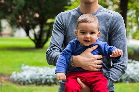 "Anonymous Man Holding Baby Boy In The Park" by Stocksy Contributor ...