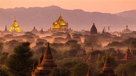 Pagoda landscape under a warm sunset in the plain of Bagan, Myanmar ...