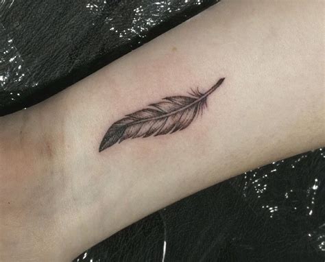 Feather tattoo wrist | Feather tattoo wrist, Feather tattoo design ...