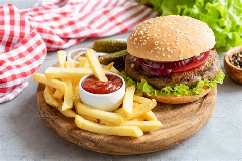 Tasty beef burger and fries | High-Quality Food Images ~ Creative Market