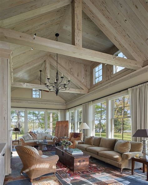 Great room at waterfront estate with beams and paneled cathedral ceiling by Barnes Vanze ...