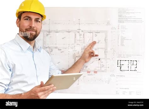 Architect / engineer at his desk planning the construction of a house ...