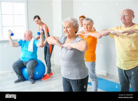 Elderly people exercising in gym Stock Photo - Alamy