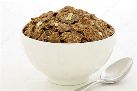 Wheat bran flakes cereal breakfast with rolled oats Stock Photo by ©rafer76 9731392