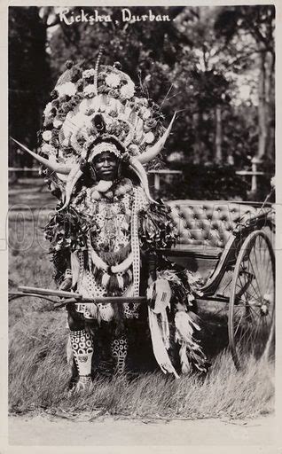 Postcard depicting a man in full costume driving a Zulu Ricksha stock image | Look and Learn