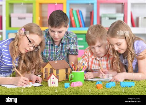 Group of children drawing with pencils Stock Photo - Alamy