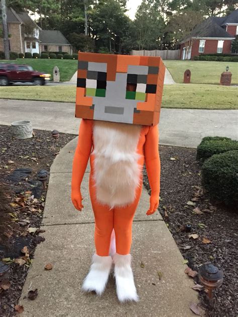 Stampy costume. Painted cardboard box, orange morphsuit and added some fur with with spray ...