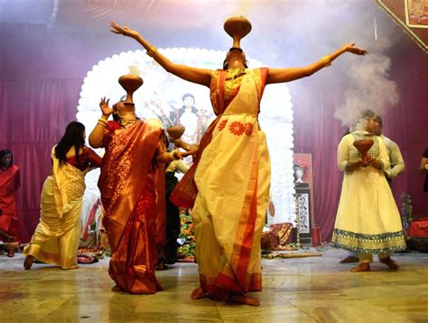 : Lucknow : Devotees performing Dhunuchi dance during Durga Puja ...