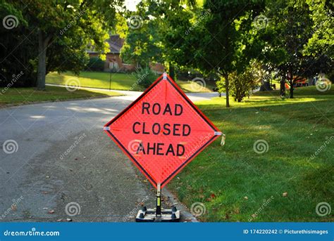 Road Closed Ahead Construction Sign in a Residential Neighborhood Stock Photo - Image of ...