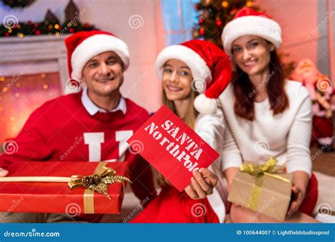 Happy family on christmas stock image. Image of mail - 100644007