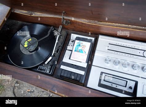 A record player and 8 track tape player at an antique and thrift store ...