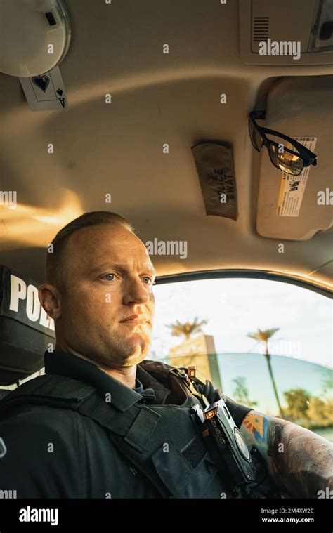 Vertical image low angle shot of of white male caucasian police officer ...