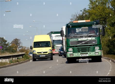 Van overtaking a lorry on a busy dual carriageway Stock Photo - Alamy