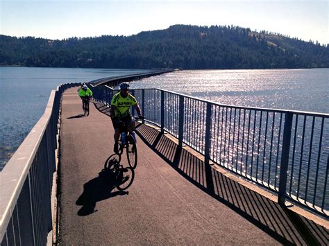 Bike tourists crossing the 3,100-foot Chatcolet Bridge over Coeur d'Alene Lake on the Trail of ...