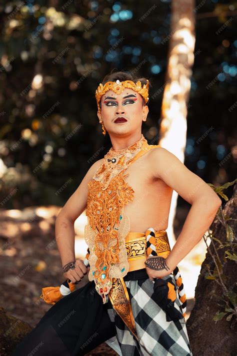 Premium Photo | Balinese dancer performs the dance in golden costume ...