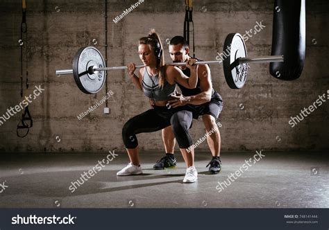 Young Woman Doing Squat Exercise Gym Stock Photo 748141444 | Shutterstock