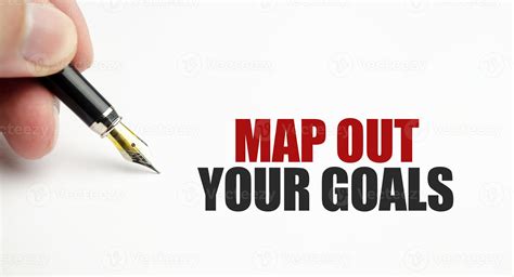 Map out your goals with pen on white background 9693451 Stock Photo at Vecteezy