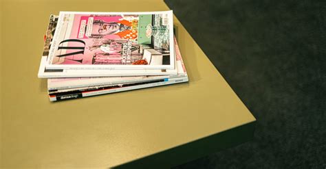 Stack of Magazines on a Table · Free Stock Photo